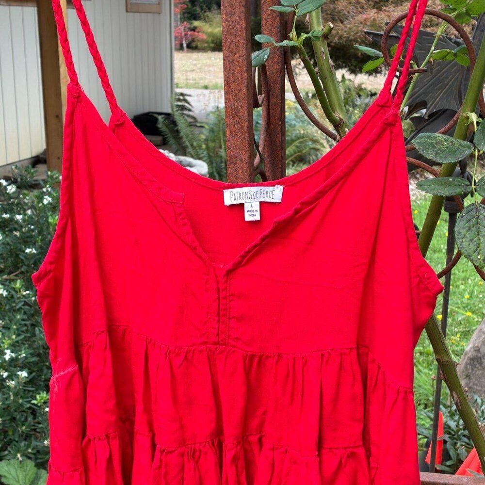 large tomato red top with tiered flounce! Also braided straps, so cute!